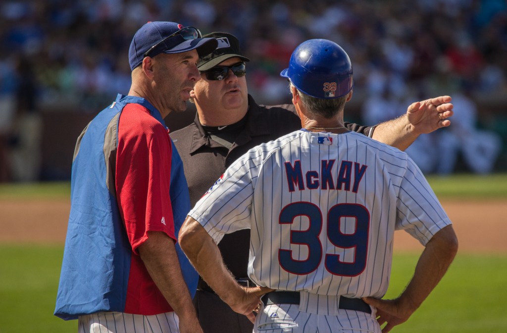Dale Sveum argues a call with first base umpire Jerry Layne